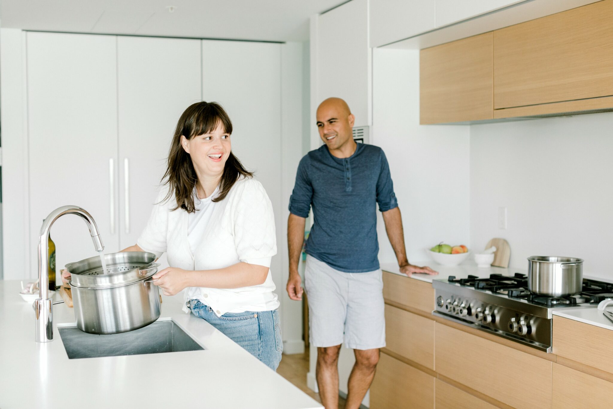 couple cooking in modern kitchen with stackware