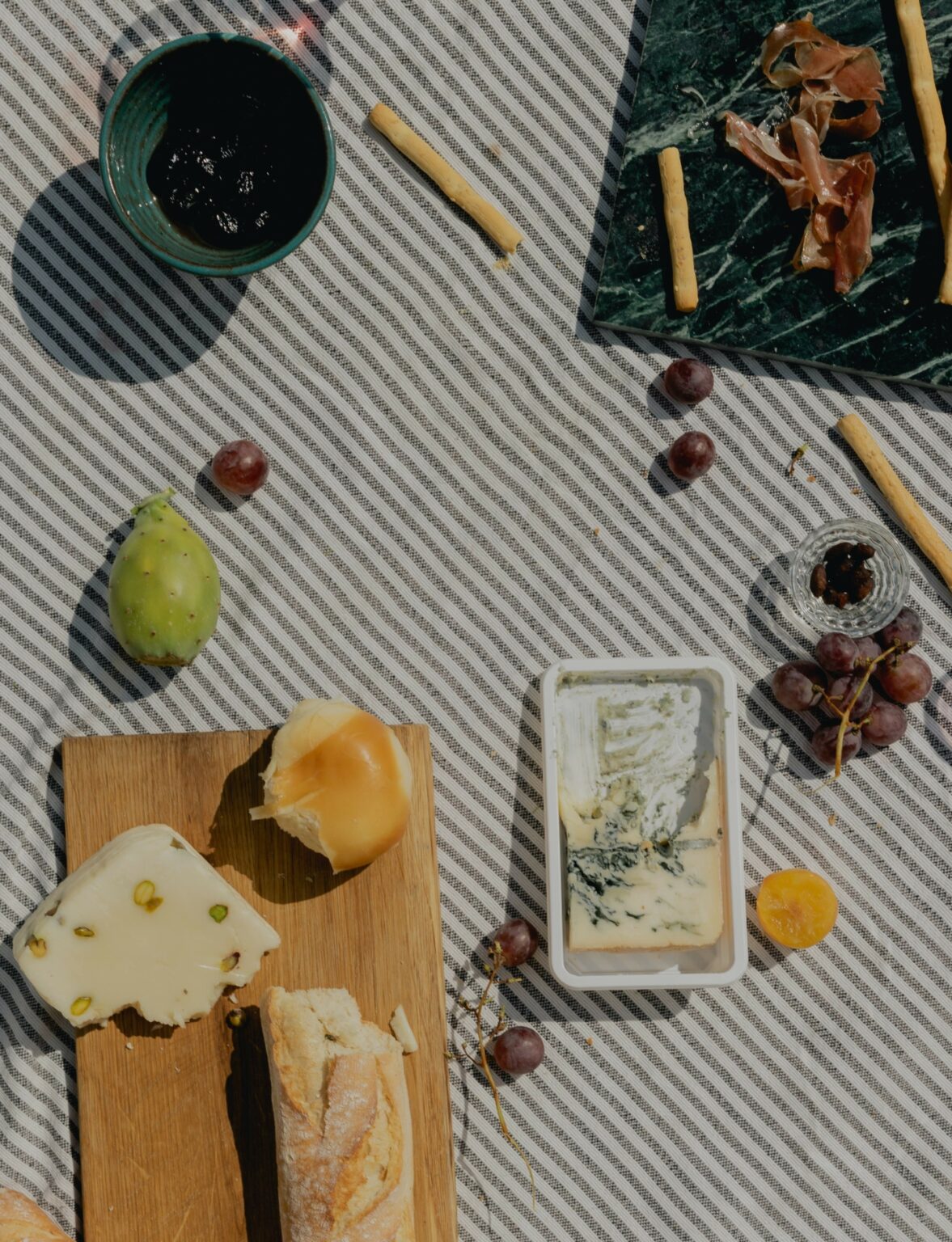 Wine, cheese, salumi baguette picnic pantry staples