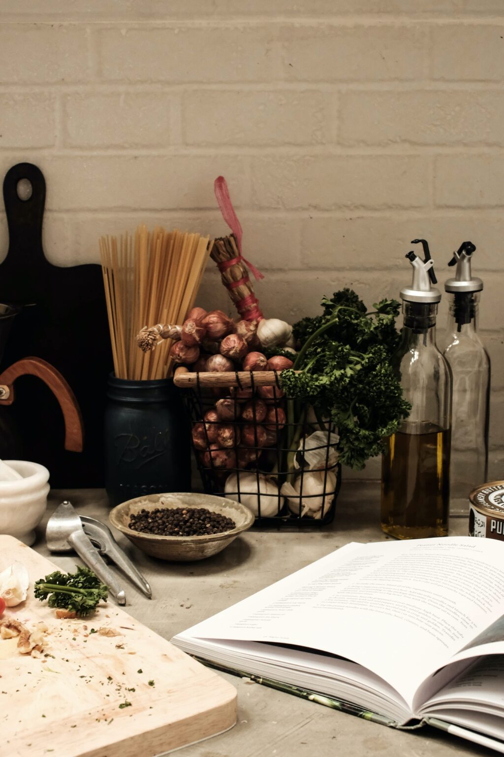 cookbook in luxury kitchen with pantry ingredients