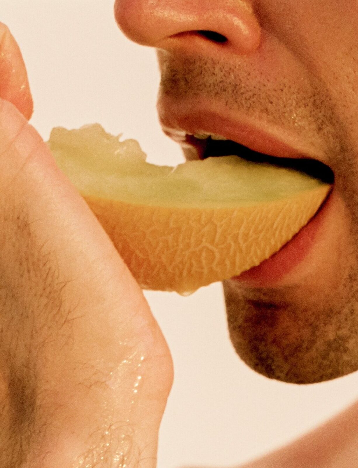 Man eating melon juicy fruit dripping food porn