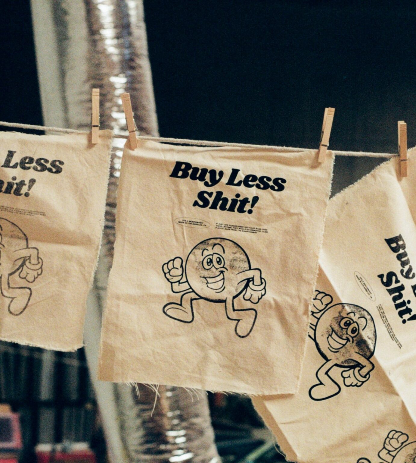 Buy less shit flag conscious consumerism