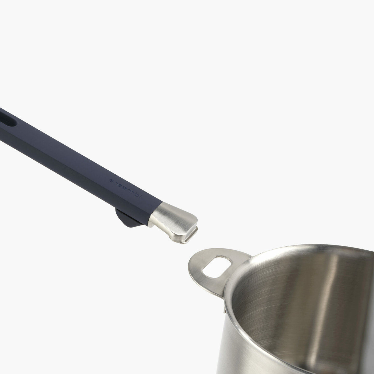 Stackware removable handle in action with saucepan