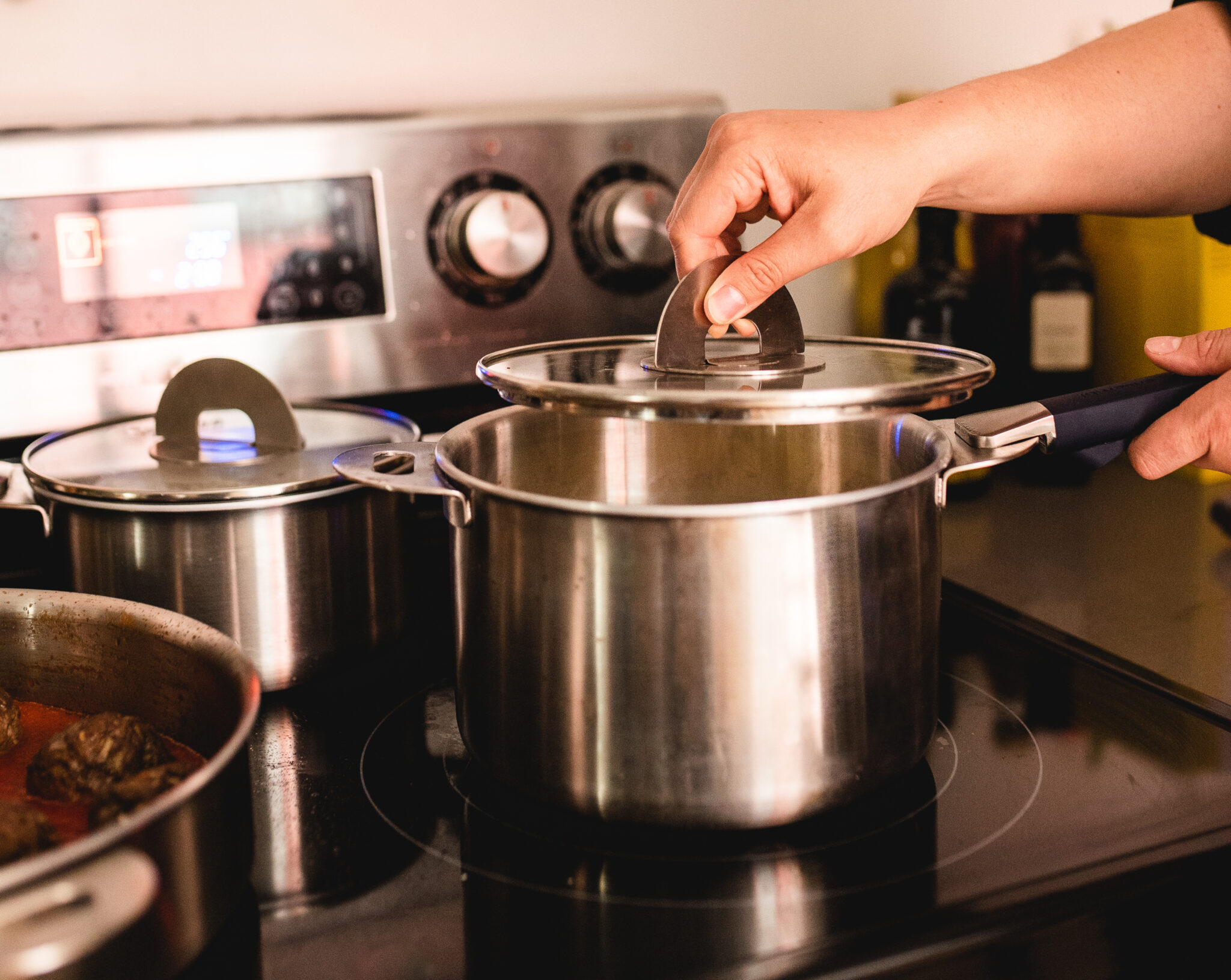 LEARN MORE about ENSEMBL Stainless Steel Fully Clad Stacking Cookware Set with removable handles. Learn how ENSEMBL engineered Stackware's lid to make it easier to stack, store, and save space. Frying Pan, Braiser Pan, Small Saucepan, Medium Saucepan, Stockpot, Steamer/Colander. Multifunctional, long-lasting, design-forward home wares. Oven-safe cookware set. Induction-safe cookware set.