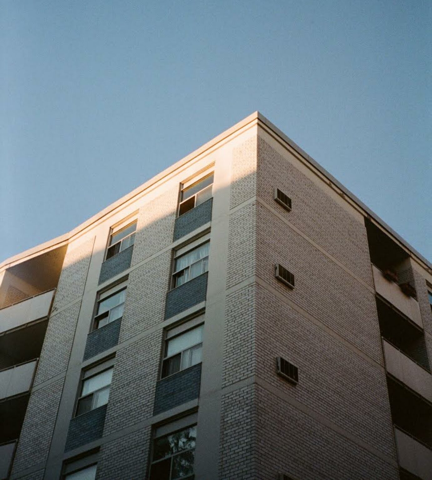 Building against blue sky with shadows