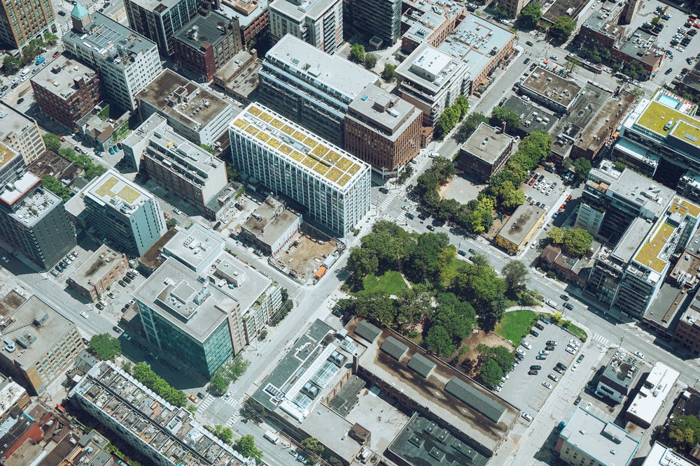 aerial sustainable cityscape with trees