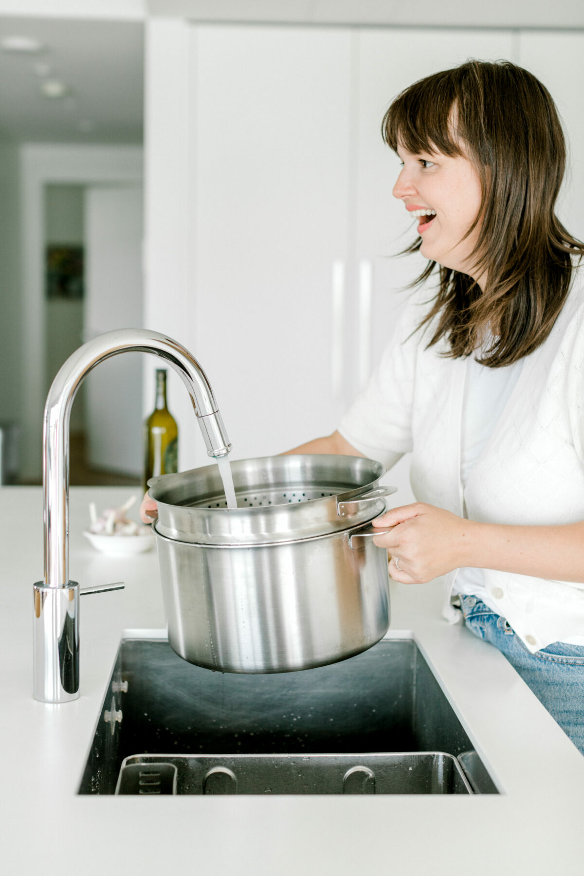 Barbora Samieian filling stockpot with water