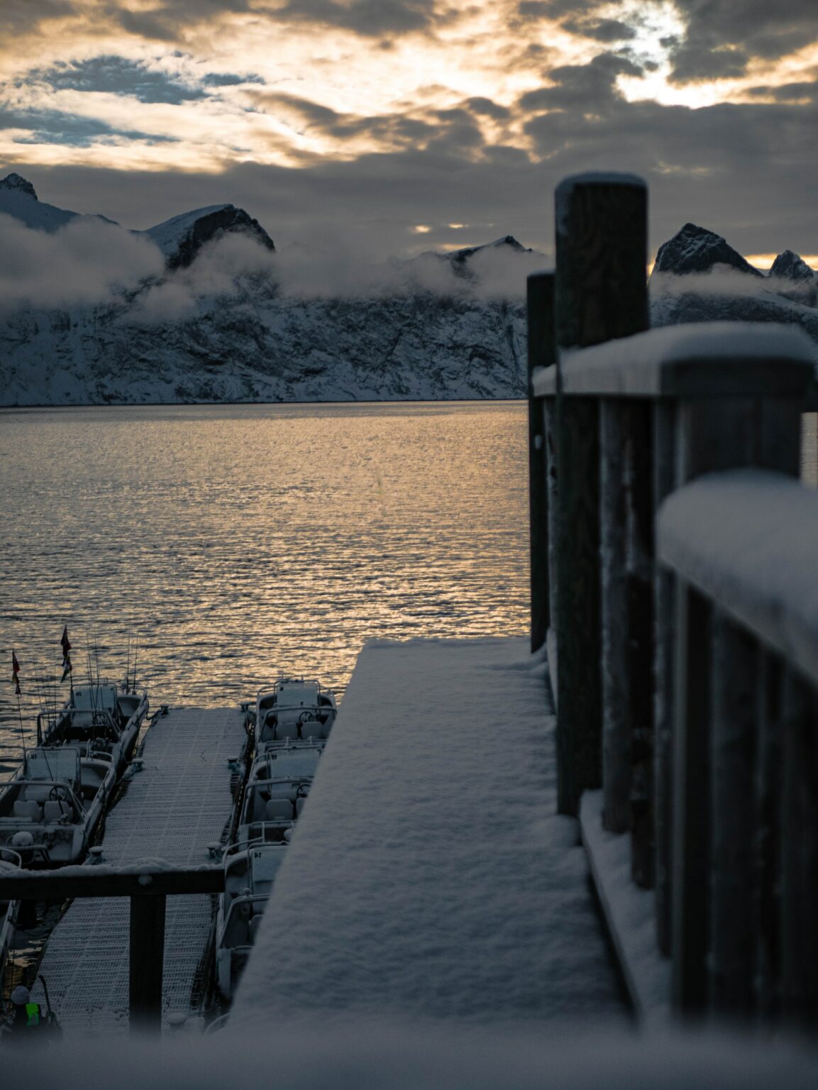Snow covered dock + winter lake